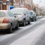 snowy road cars